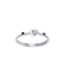 Load image into Gallery viewer, Love Knot Ring with Blue Sapphires  Handcrafted with Sterling Silver and Blue Sapphires on each side of the Love Knot. Blue Sapphire's spiritual power of wisdom brings the wearer healing and strength allowing them to feel free minded and confident.