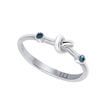 Load image into Gallery viewer, Love Knot Ring with Blue Sapphires  Handcrafted with Sterling Silver and Blue Sapphires on each side of the Love Knot. Blue Sapphire's spiritual power of wisdom brings the wearer healing and strength allowing them to feel free minded and confident.
