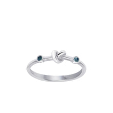 Load image into Gallery viewer, Love Knot Ring with Blue Sapphires  Handcrafted with Sterling Silver and Blue Sapphires on each side of the Love Knot. Blue Sapphire&#39;s spiritual power of wisdom brings the wearer healing and strength allowing them to feel free minded and confident.