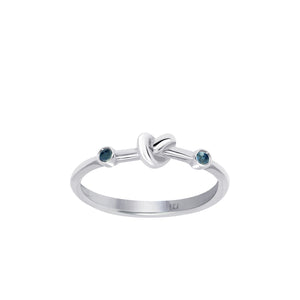 Love Knot Ring with Blue Sapphires  Handcrafted with Sterling Silver and Blue Sapphires on each side of the Love Knot. Blue Sapphire's spiritual power of wisdom brings the wearer healing and strength allowing them to feel free minded and confident.