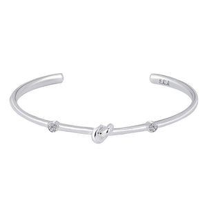 Love Knot Bracelet with White Topaz | Aquamarine  This simple design is handcrafted with Sterling Silver to convey the message of eternal love.  Sterling Silver   White Topaz: 2.5mm  Aquamarine: 2.5mm